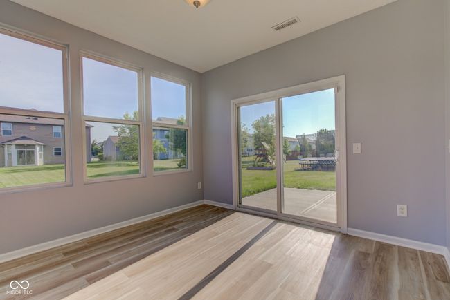 unfurnished room with wood finished floors and baseboards | Image 24