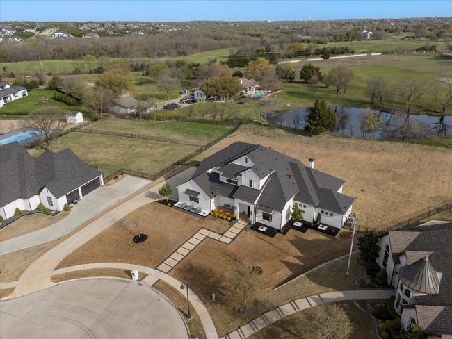 Extended driveway on cul de sac provides ample parking for family and guest | Image 34