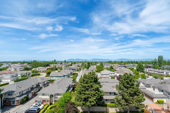 Aerial view of residential area featuring mountains | Image 26