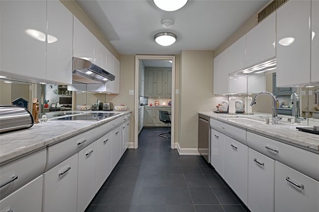 Kitchen facing breakfast room from the back door of the unit | Image 8