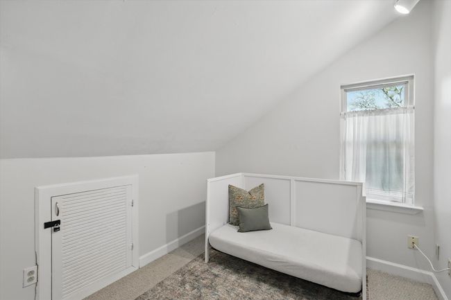 Unfurnished room with vaulted ceiling and carpet flooring | Image 25