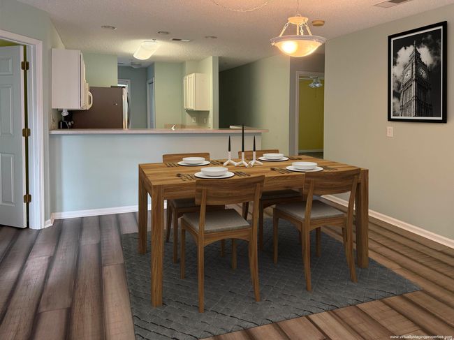 Dining room with dark wood-type flooring, baseboards, and ceiling fan | Image 9