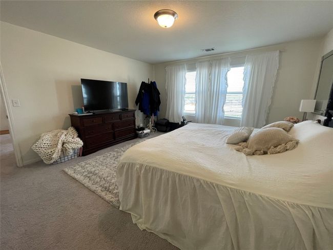The en suite has a 6' walk -in shower, extended vanity & walk in closet. | Image 24