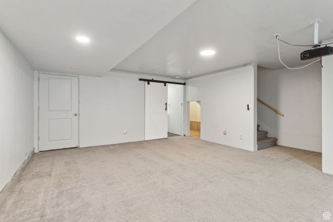 The fully finished basement features a secondary primary (4th bedroom) with 3/4 bathroom. Which would also make for a great family room with included projector. | Image 27