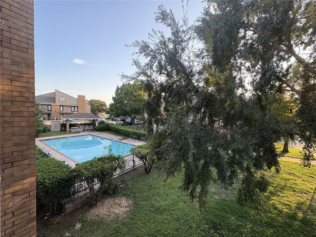 View of swimming pool featuring a patio | Image 17