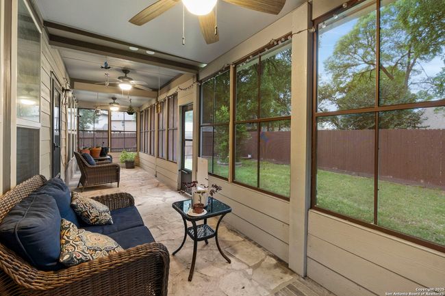 Screened in back porch with 2 ceiling fans | Image 33
