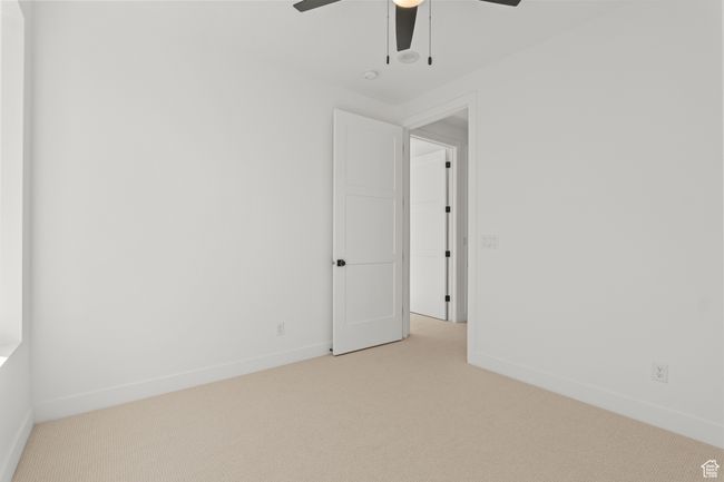 Empty room with carpet floors and ceiling fan | Image 39