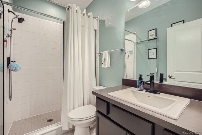 Full bath 1 on main floor next to office/bedroom | Image 6