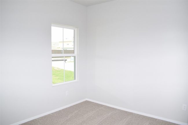 Spare room featuring carpet and baseboards | Image 16