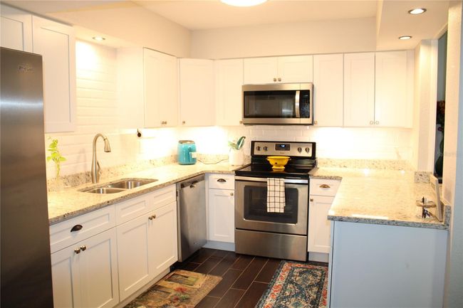 Plenty of cabinets and counter space. | Image 8
