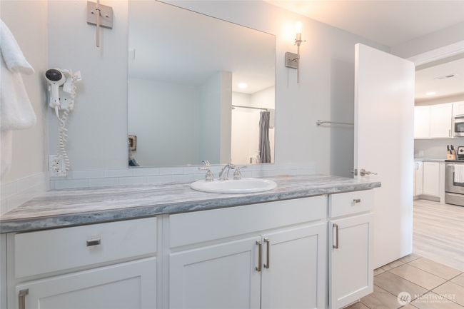 Sparkling, new and fresh with modern, designer finishes and fixtures! Look at the maximized counterspace! | Image 19