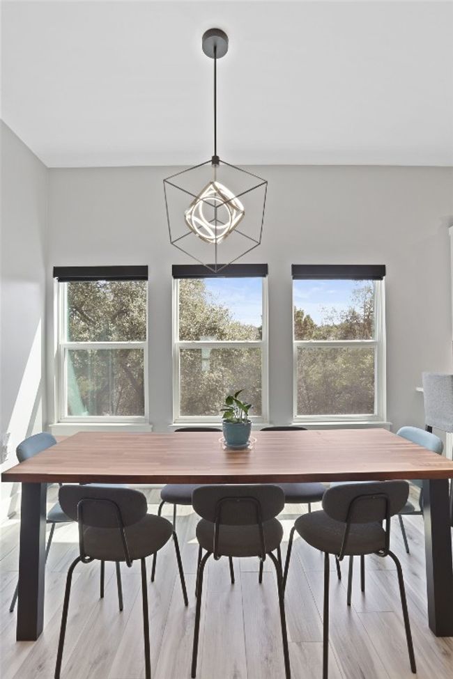 Dining room with a healthy amount of sunlight and amazing views. | Image 4