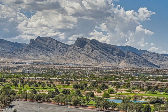 View of mountain backdrop with a large body of water | Image 29