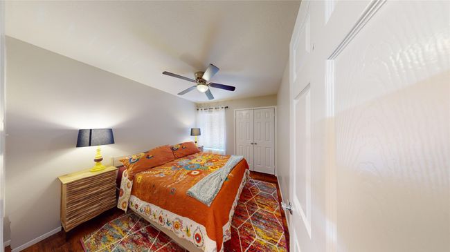Bedroom featuring a ceiling fan and baseboards | Image 10
