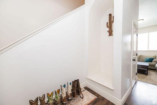 Interior space featuring wood finished floors and baseboards | Image 6