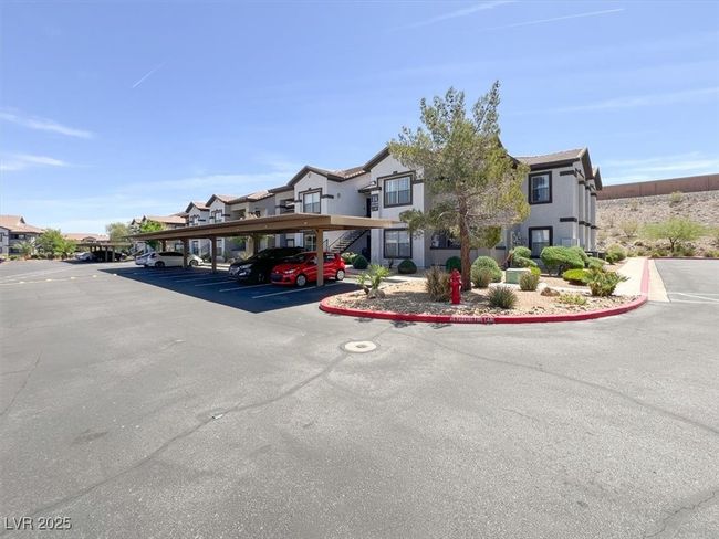 View of property featuring covered parking and a residential view | Image 4