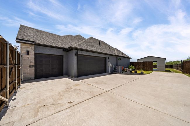 3 car garage with epoxied floors. | Image 34