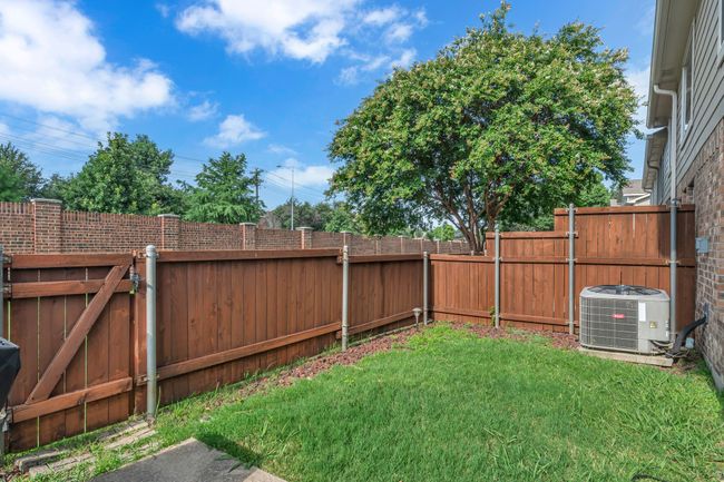 View of fenced backyard | Image 27