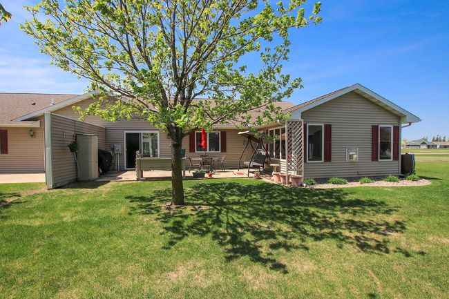 The backyard features an 11'x27' foot concrete patio. | Image 13