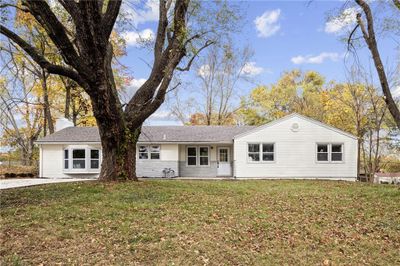 Ranch-style home with a front yard | Image 1