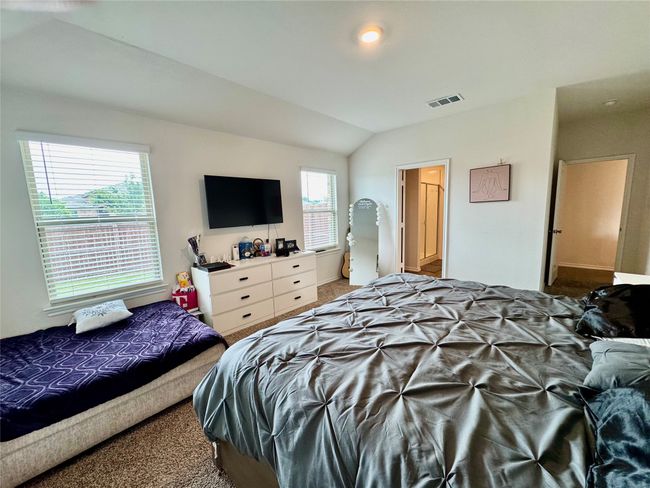 Bedroom featuring carpet and vaulted ceiling | Image 7