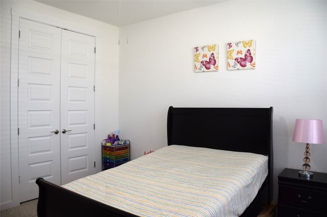 Bedroom with a closet | Image 16