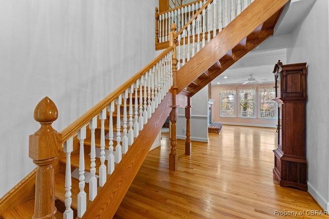 Stairway featuring wood finished floors and ceiling fan | Image 16
