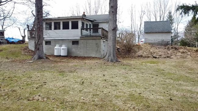 View of home's exterior with a chimney | Image 16