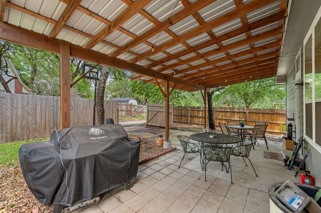 Fenced backyard with outdoor dining area, area for grilling, and a patio area | Image 31