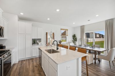 (Photo of decorated model, actual homes color and finishes will vary) Another view of the spacious kitchen! | Image 2