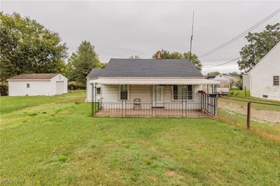 View of front facade with a front yard | Image 1