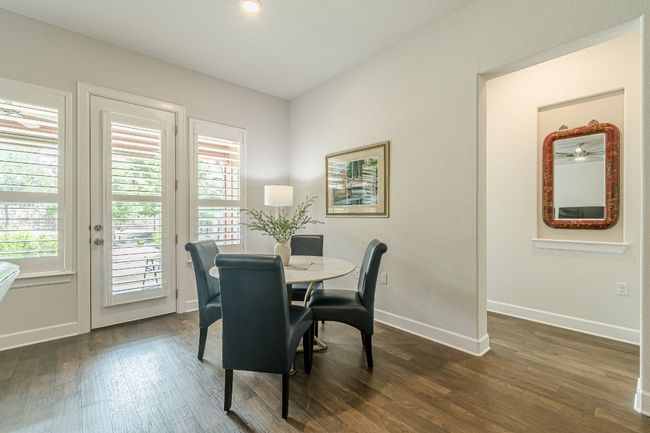 Dining area featuring healthy amount of natural light, dark wood-style flooring, and baseboards | Image 25