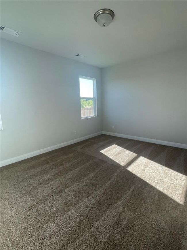 Empty room with dark carpet and baseboards | Image 7