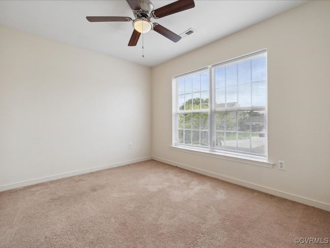 Empty room featuring light carpet and a ceiling fan | Image 17