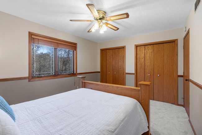 This bedroom also features two closets, and there are definitely no gender jokes to be made about who has more closet needs. | Image 15