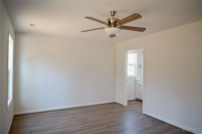 Unfurnished room with wood-type flooring and ceiling fan | Image 11