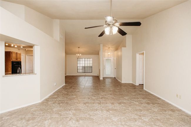 View from Fireplace looking at Dining, Kitchen and Living Rooms | Image 4