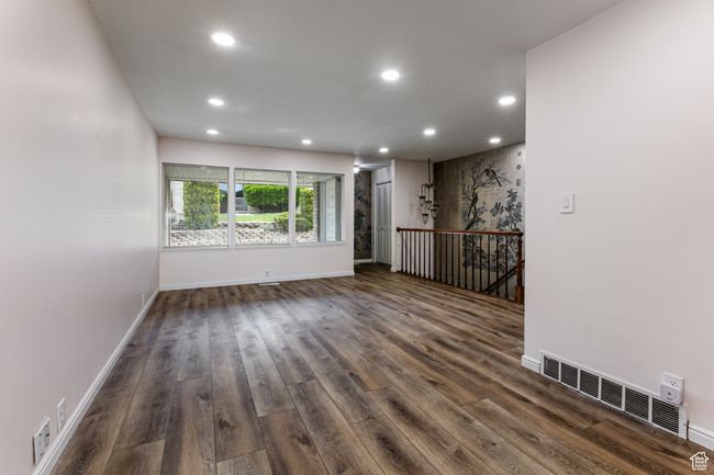 Spare room featuring recessed lighting, dark wood finished floors, and baseboards | Image 9