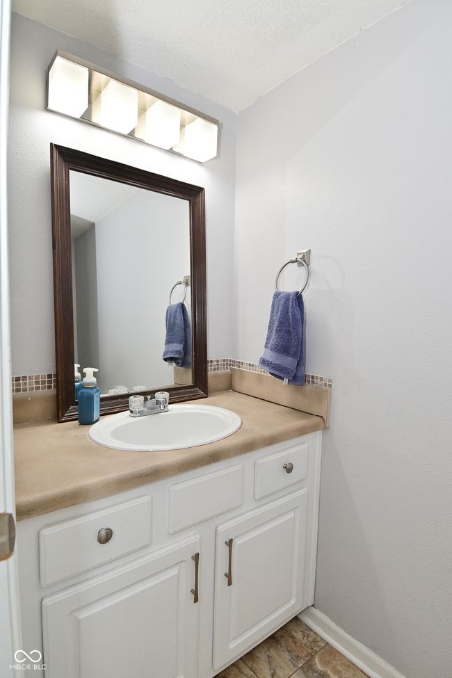 bathroom with vanity and baseboards | Image 25