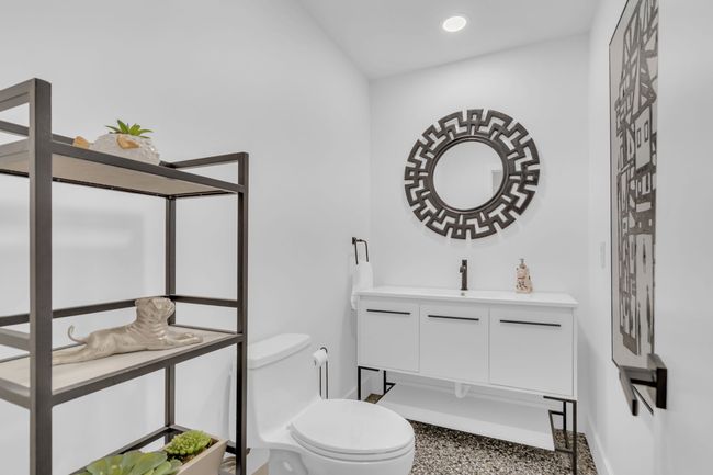 Bathroom featuring speckled floor, baseboards, vanity, toilet, and recessed lighting | Image 32