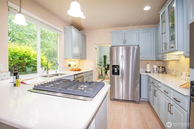 Kitchen with new Gas top Cooking. | Image 10