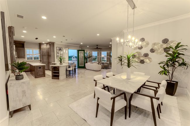 Dining room featuring crown molding, recessed lighting, a chandelier, and ceiling fan | Image 19
