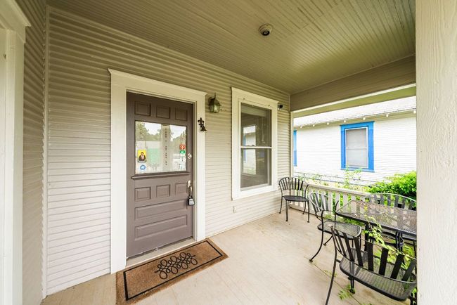 View of exterior entry featuring a porch | Image 21
