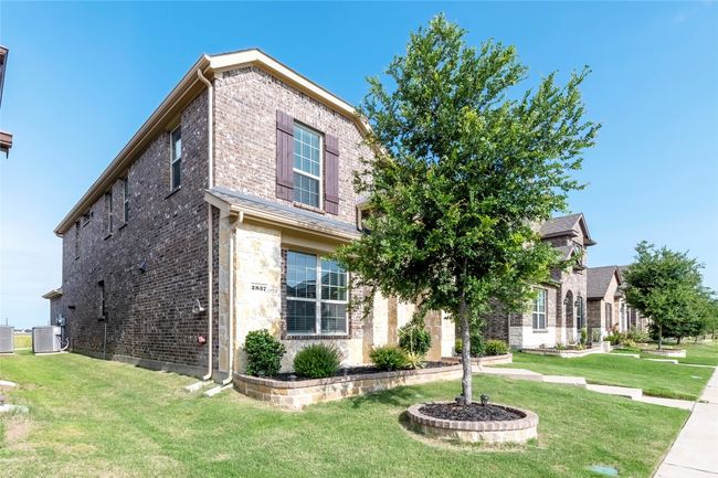 View of front of property with brick siding, a front yard, and stone siding | Image 36