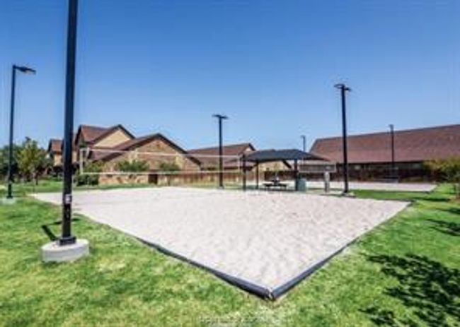 View of home's community featuring a yard and volleyball court | Image 35
