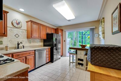 Kitchen with sliders to patio. | Image 2