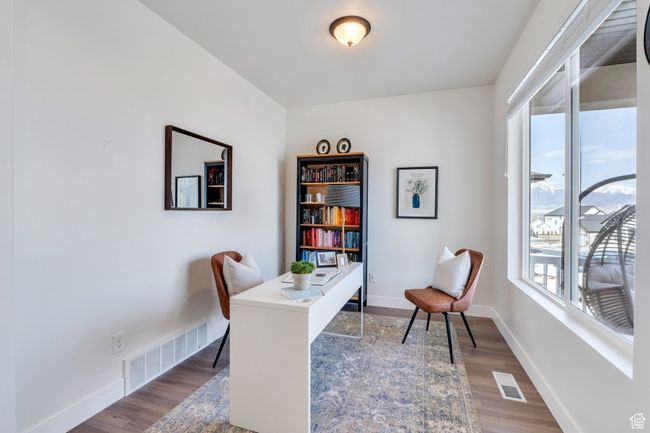 Office space featuring visible vents, baseboards, and dark wood-style floors | Image 10