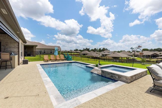 Relax poolside with stunning views of Lake Conroe. | Image 41