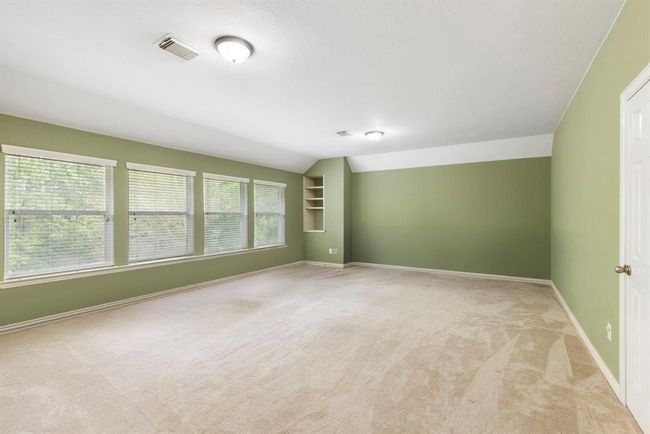 Large Game room on 2nd floor. Storage closet on the right with built in shelves at far end. | Image 27