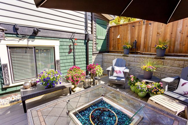 View of patio / terrace with a fire pit and fence | Image 32